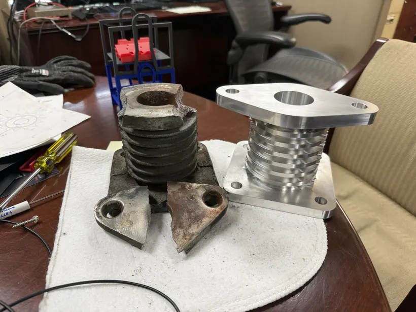 Side-by-side comparison of the worn original component and the machined replacement.