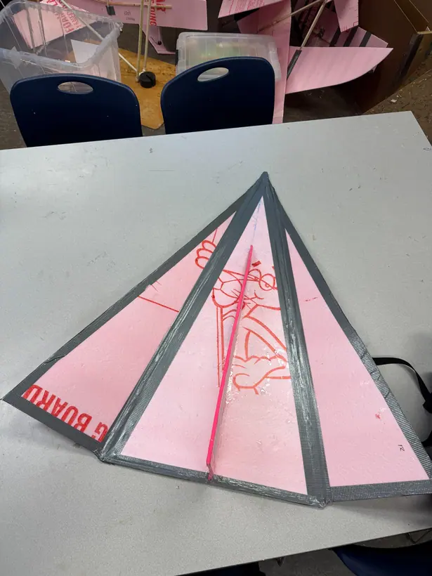 Head-on view of the glider prototype showing the raised centre member and the dihedral of the wing panels.